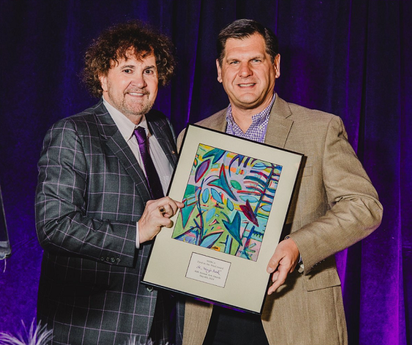 Tom Raffio, Chairman of the New Hampshire Business Committee for the Arts, presents Ken Senus, President and CEO of St. Mary’s Bank, with the Dyed-in-the-Wool Arts Award on Monday, May 6, 2024. Photo courtesy of Esmeldy Angeles